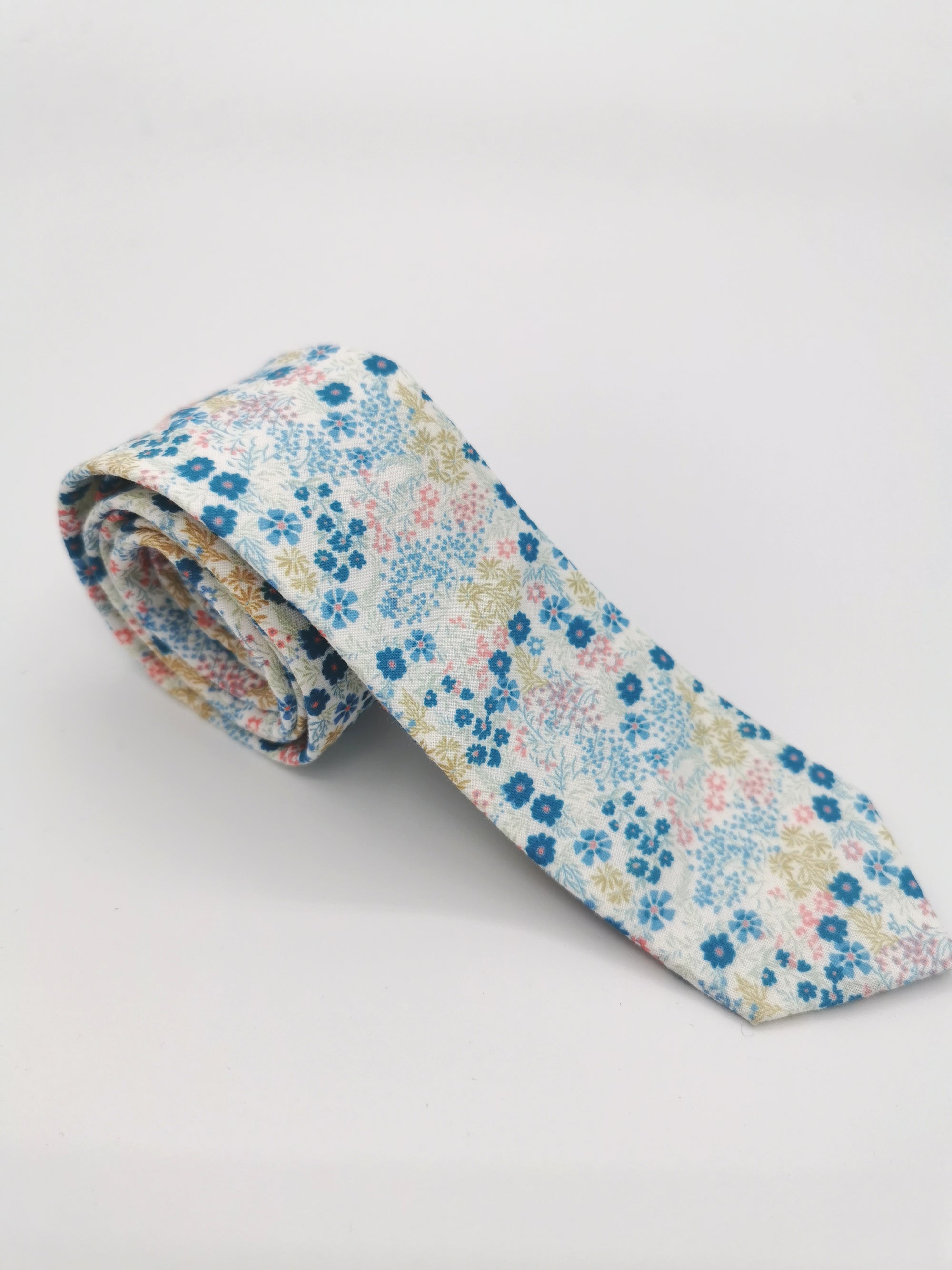 Fine cotton tie with light blue and pink floral pattern