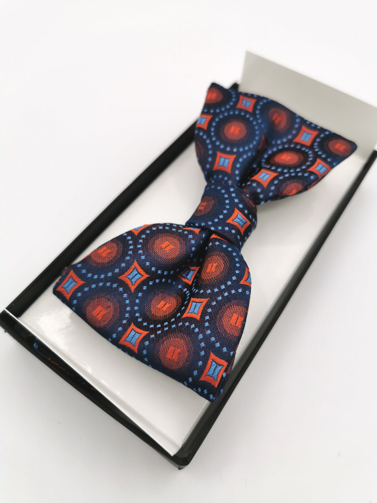 Ferala silk bow tie with circles and orange diamonds