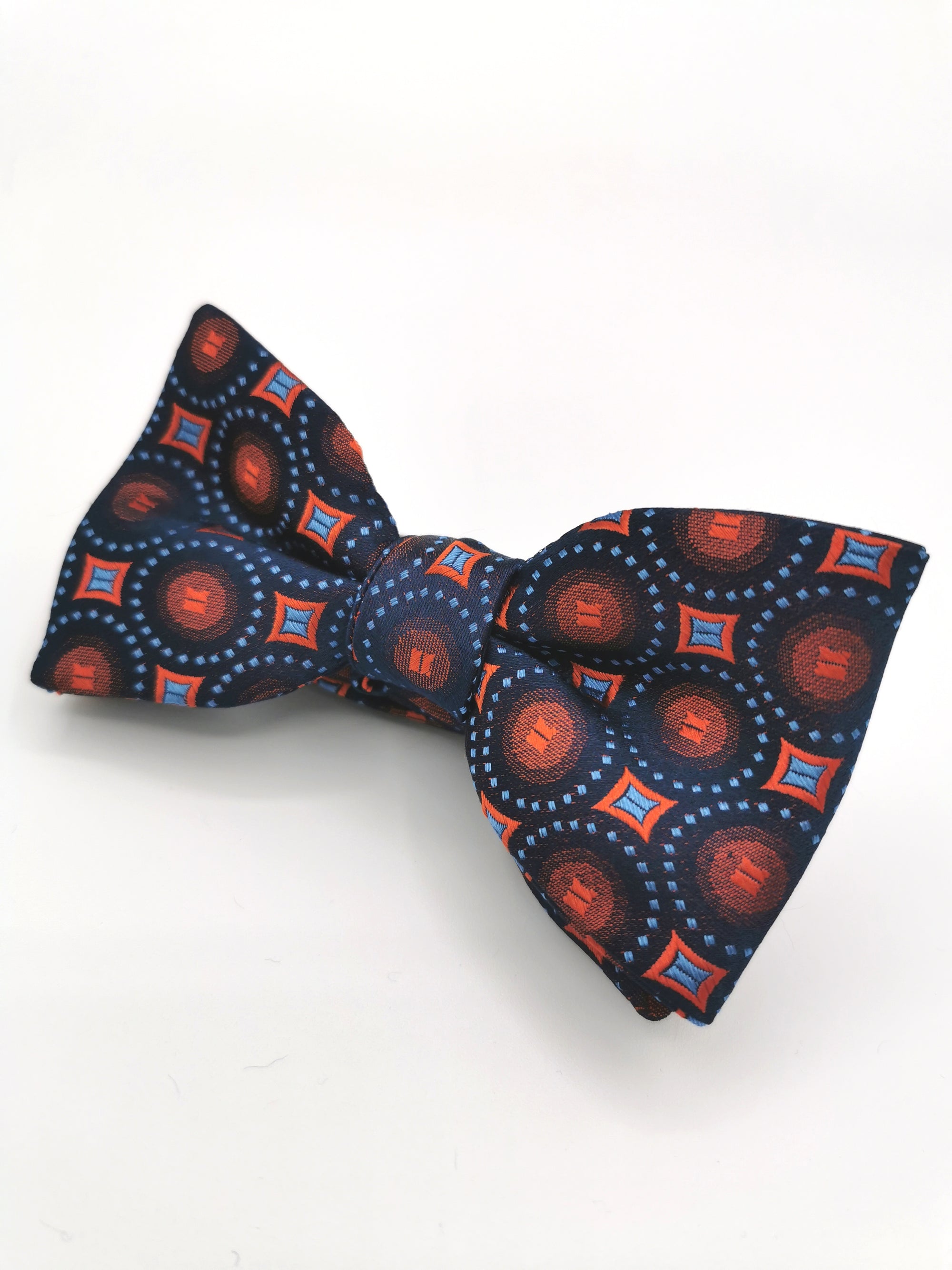 Ferala silk bow tie with circles and orange diamonds