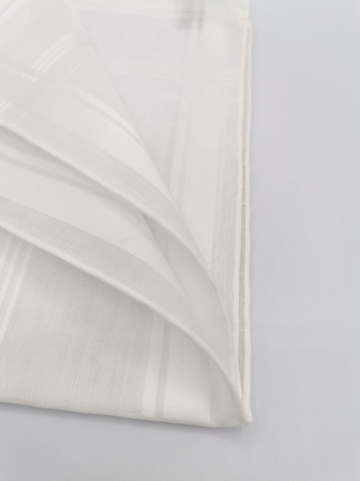 White Simonnot-Godard pocket square with several white satin bands