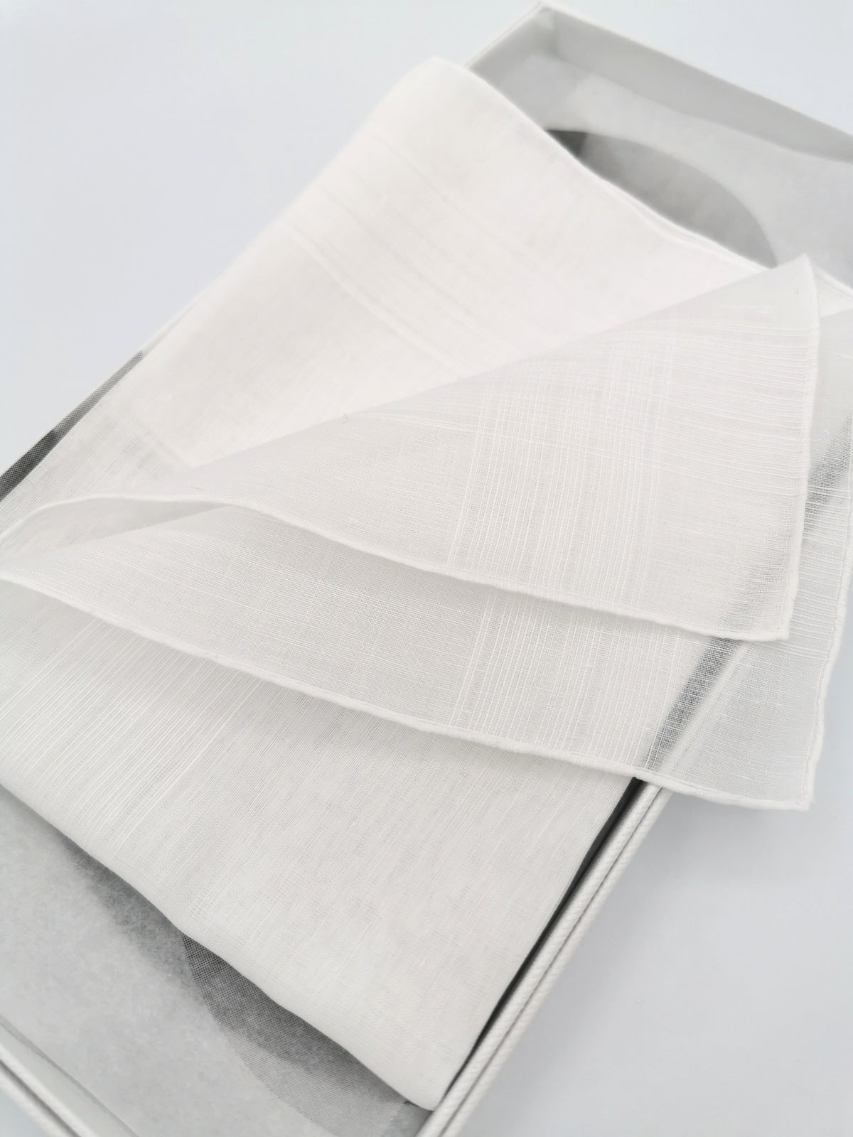 White Simonnot-Godard pocket square with several woven bands on the edges, Archives Collection
