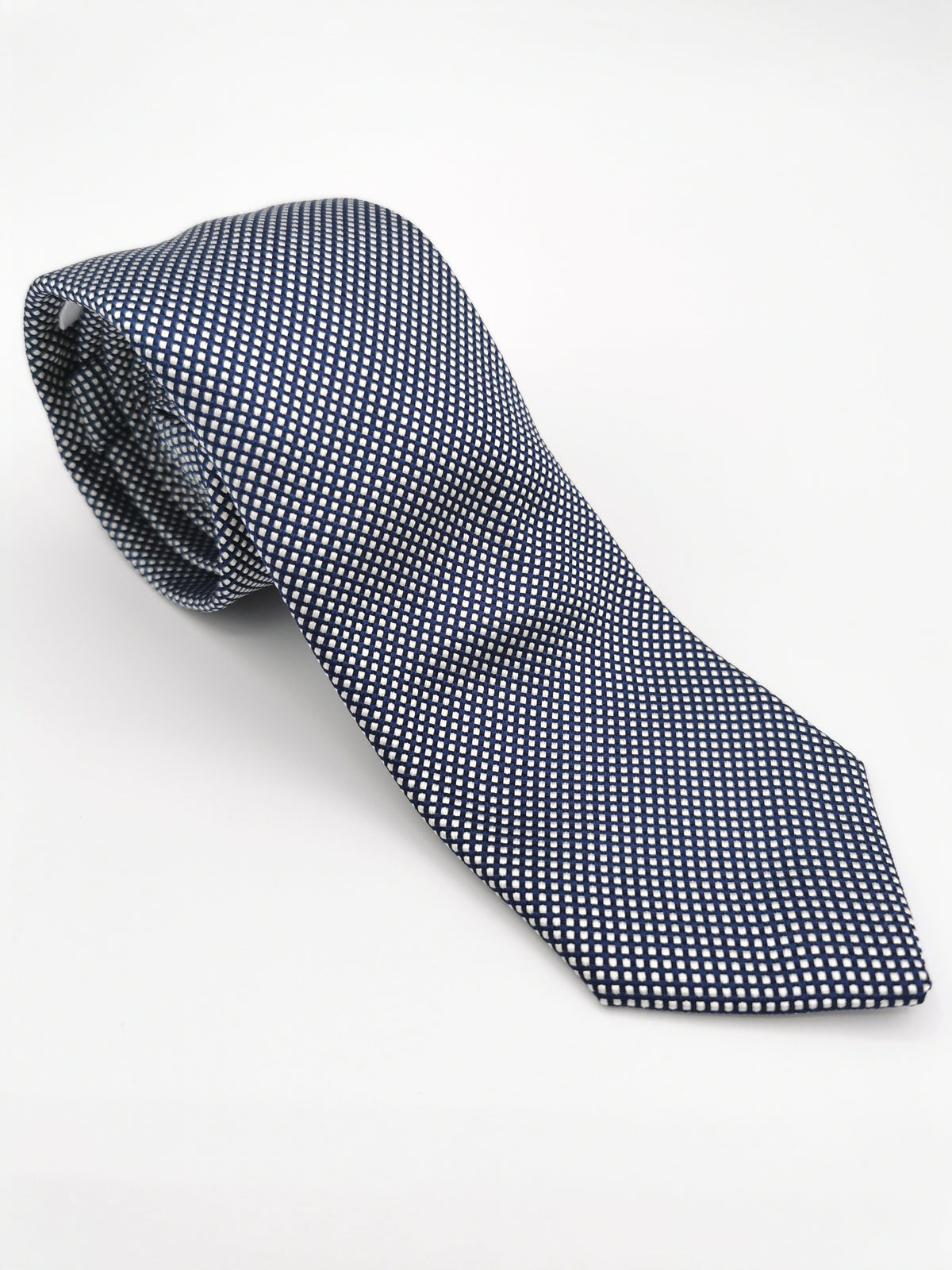 Ferala tie in navy blue with small white polka dots