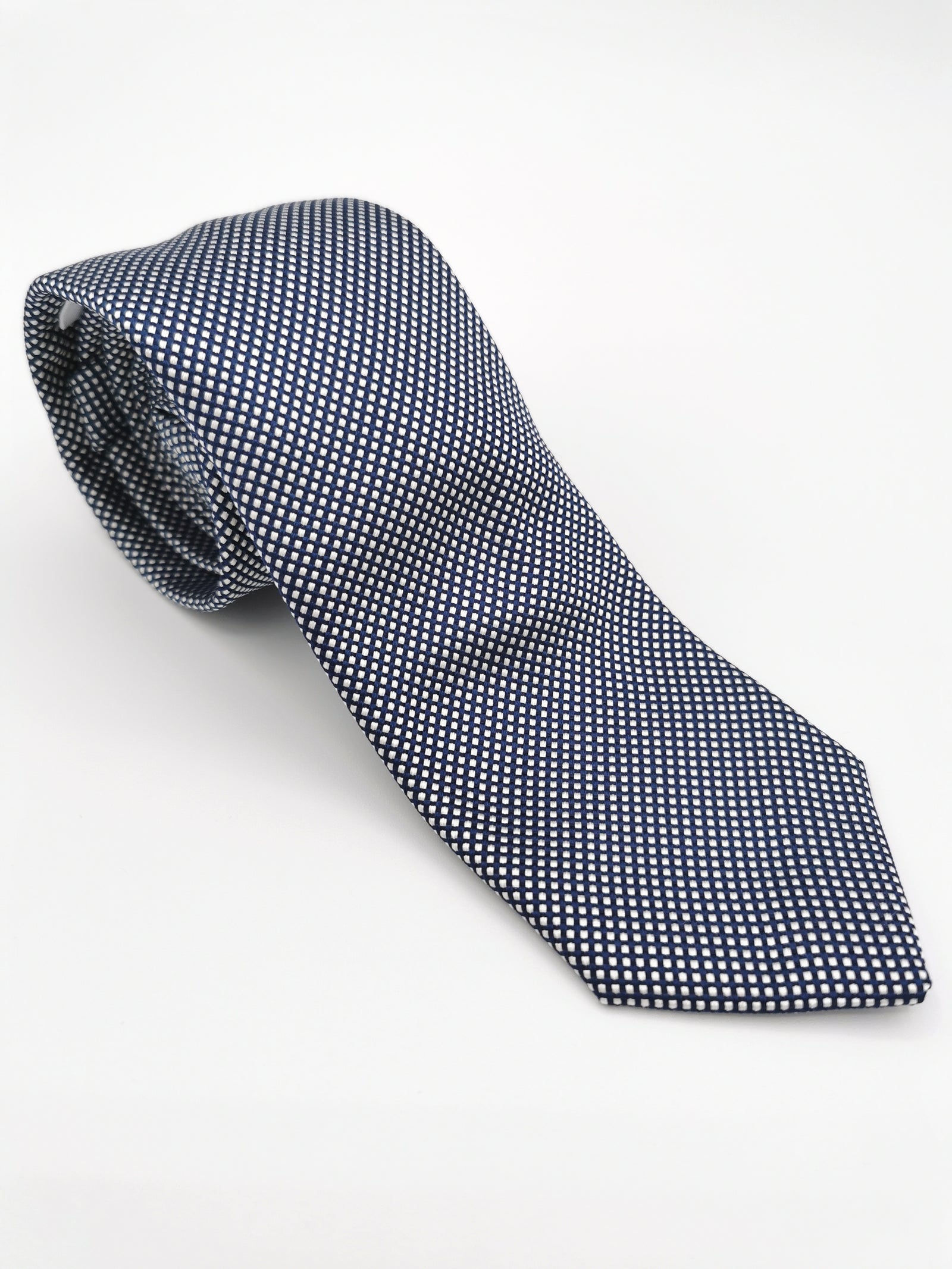 Ferala tie in navy blue with small white polka dots