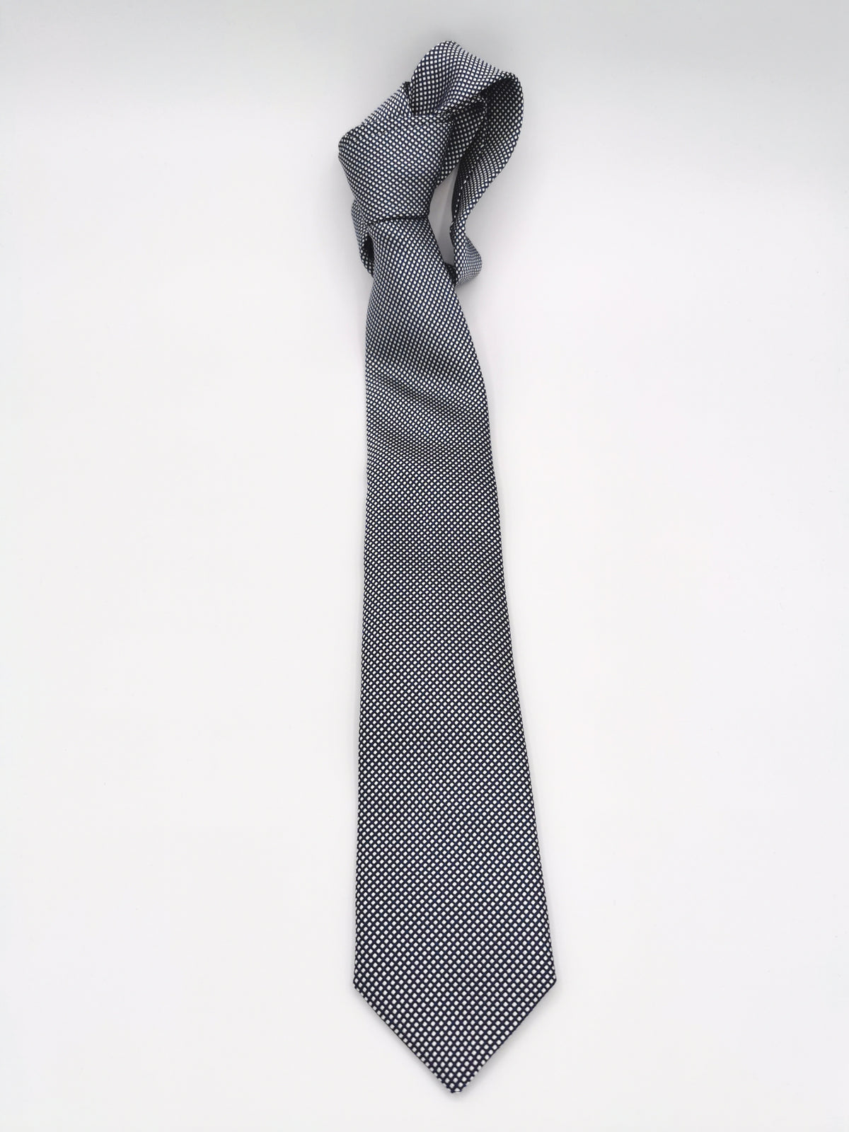 Ferala tie in navy blue with small white polka dots