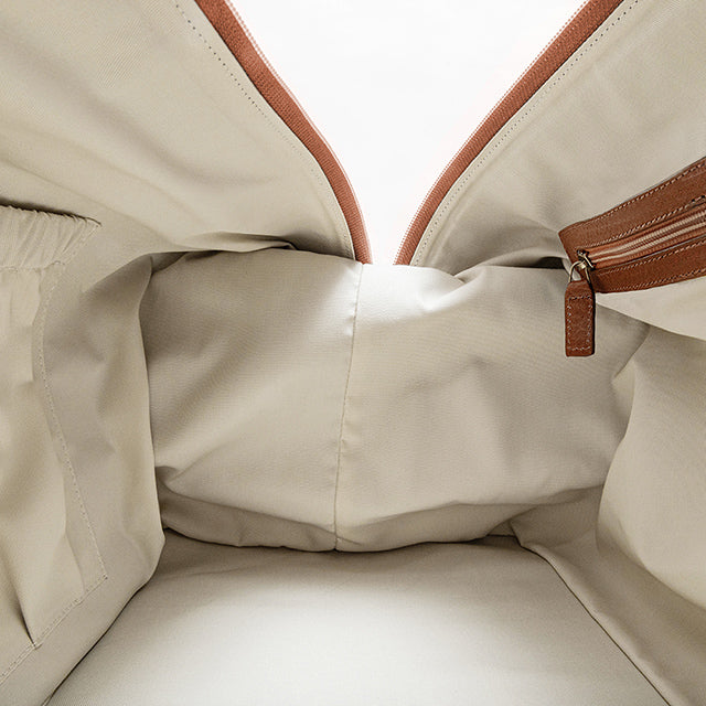 Beige canvas duffle bag